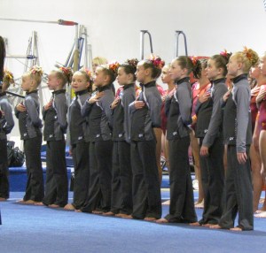 Listening to the national anthem before the competition begins. Photo courtesy of Erin Pelton.